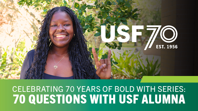 Rosa Nafrere smiling and holding up a go bulls hand sign
