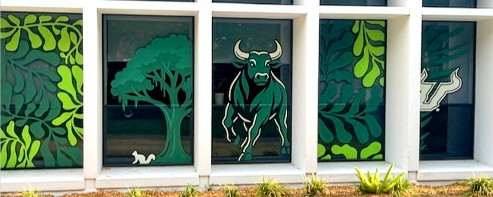Green decals of a bull and palm leaves