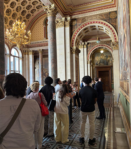 a group of people in an elegant room