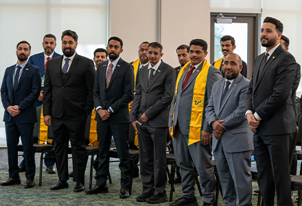 Group of people standing smiling