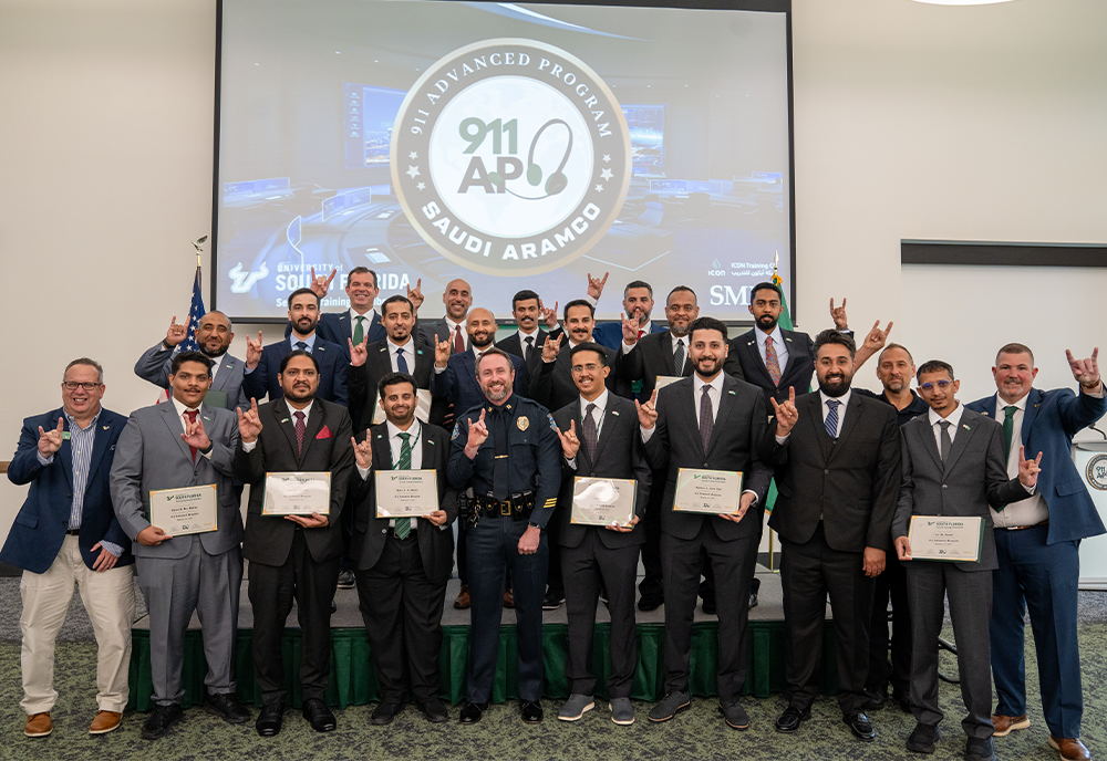 Group of people holding certificates and smiling