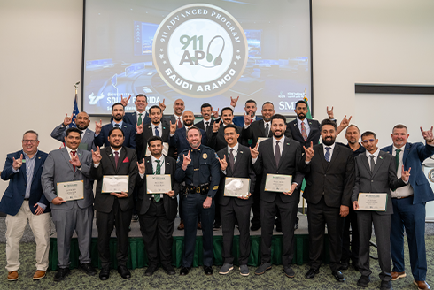 Group of people holding certificates and smiling